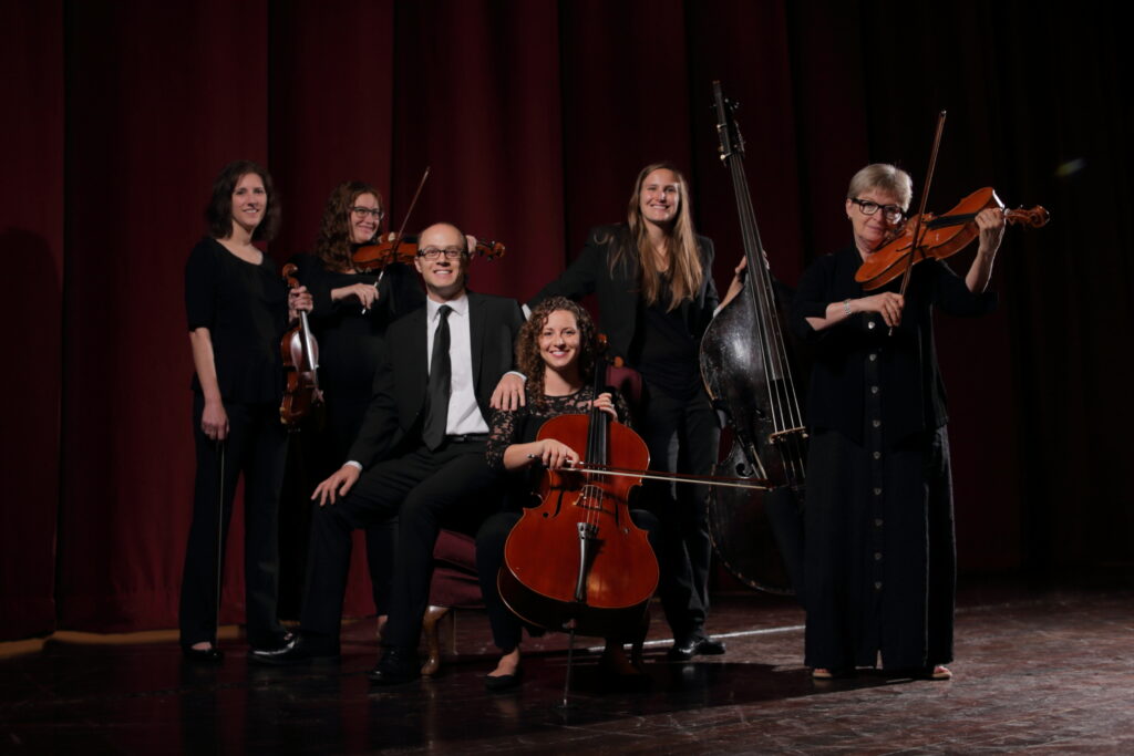The White Spruce Chamber Players posing with instruments
